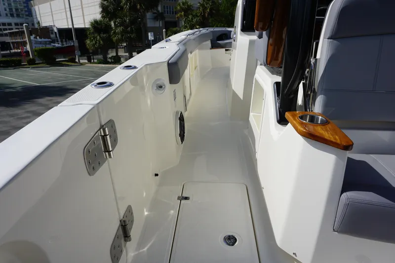 Bwce0497i324 Yacht Photos Pics 2024 Boston Whaler 360 Outrage boat deck with seating and cup holder.
