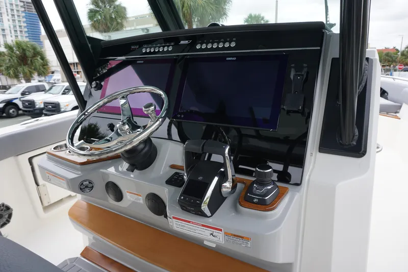Bwce0497i324 Yacht Photos Pics 2024 Boston Whaler 360 Outrage helm with dual screens and advanced controls.