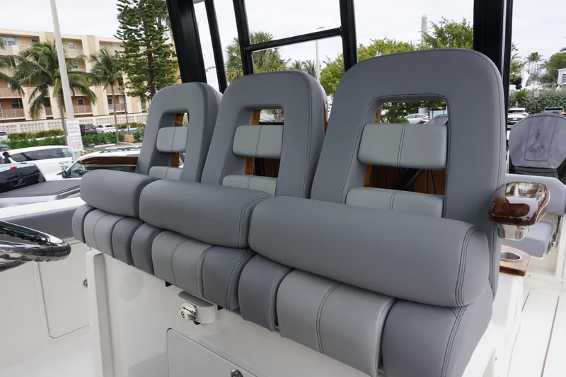 Bwce0497i324 Yacht Photos Pics 2024 Boston Whaler 360 Outrage boat with luxurious gray seating.