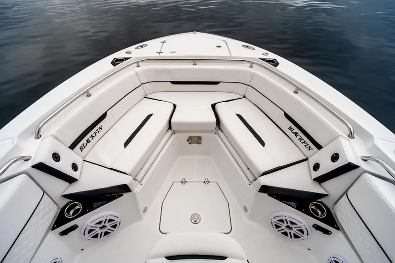 Blackfin 252cc Yacht Photos Pics 2023 Blackfin 252 CC boat interior with white seating and sleek design.
