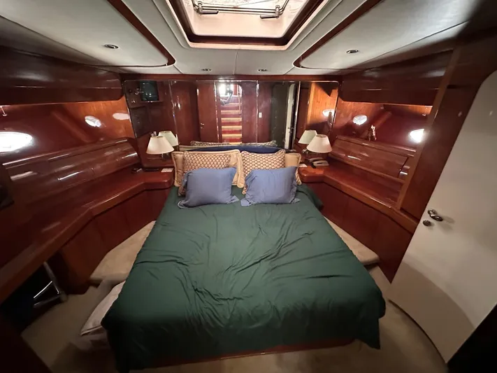 Euphoria Yacht Photos Pics Luxurious cabin interior of 2001 Johnson 70 yacht with cozy bedding.
