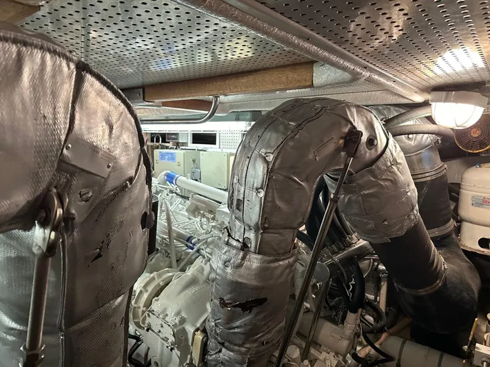 Euphoria Yacht Photos Pics Engine room of a 2001 Johnson 70 yacht with insulated exhaust pipes.