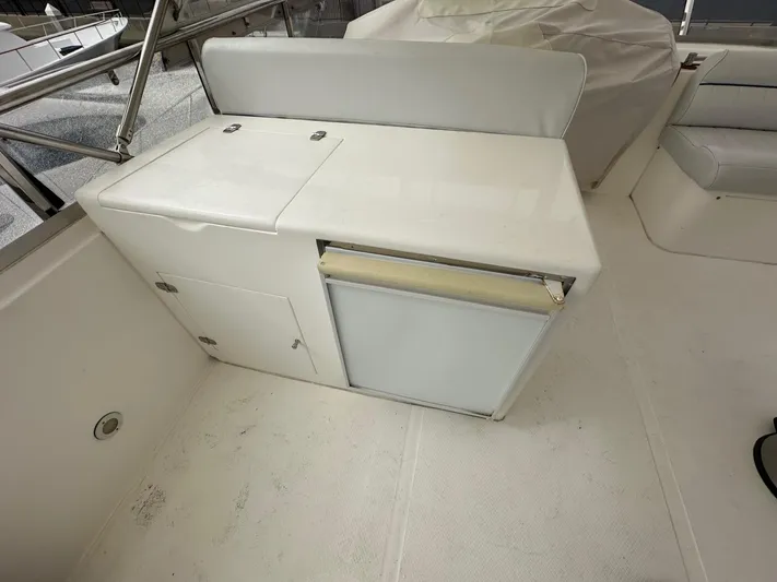 Euphoria Yacht Photos Pics Interior of a 2001 Johnson 70 yacht with a compact kitchenette.