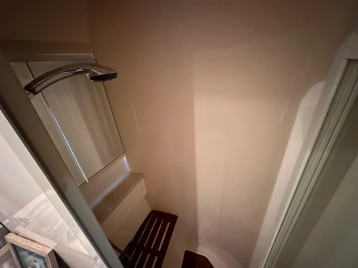 Euphoria Yacht Photos Pics Compact shower area with wooden bench, Johnson 70 model, 2001.