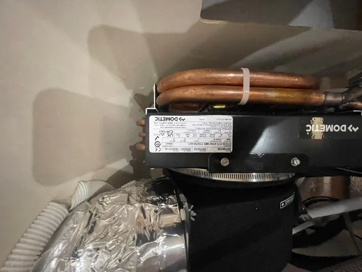 Rudee's Ruckus Yacht Photos Pics Dometic air conditioning unit in 2006 Carver 46 Motor Yacht.