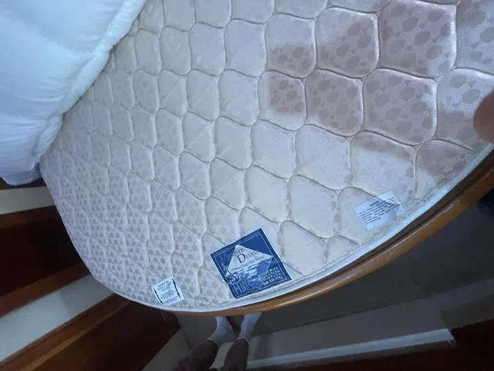 Rudee's Ruckus Yacht Photos Pics Mattress on Carver 46 Motor Yacht, 2006 model, with quilted pattern and labels.