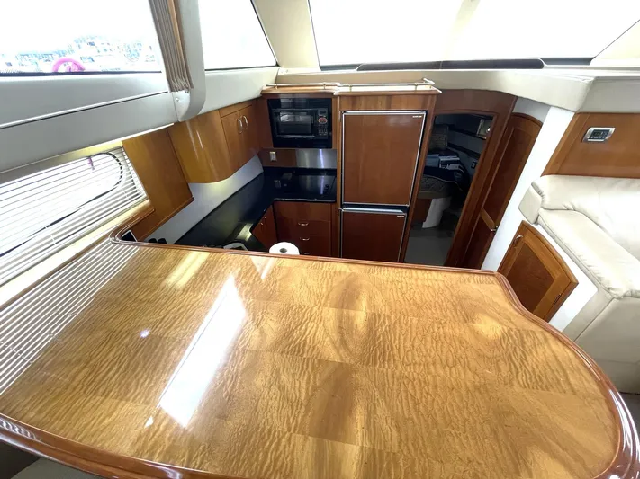 Rudee's Ruckus Yacht Photos Pics Luxurious interior of 2006 Carver 466 Motor Yacht with wood finish and modern amenities.