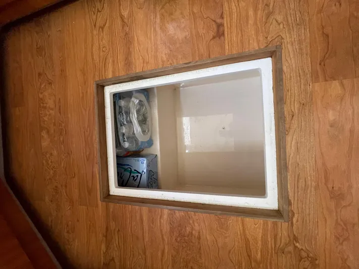 Rudee's Ruckus Yacht Photos Pics GALLEY IN-FLOOR STORAGE