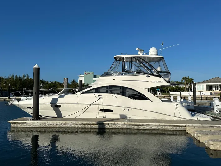  Yacht Photos Pics 2008 Sea Ray 47 Sedan Bridge yacht docked at marina under clear blue sky.