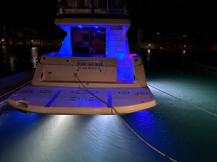  Yacht Photos Pics 2008 Sea Ray 47 Sedan Bridge yacht illuminated with blue lights at night.