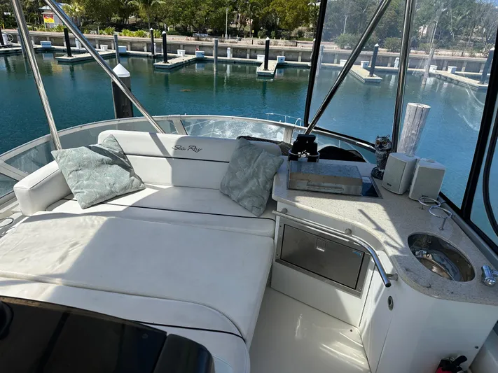  Yacht Photos Pics Luxurious 2008 Sea Ray 47 Sedan Bridge yacht interior with plush seating and scenic marina view.