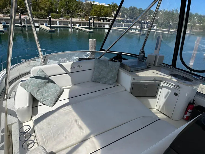  Yacht Photos Pics 2008 Sea Ray 47 Sedan Bridge yacht interior with cushioned seating and marina view.