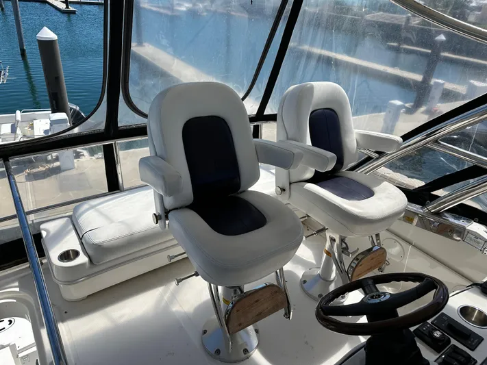  Yacht Photos Pics 2008 Sea Ray 47 Sedan Bridge helm with dual captain chairs and steering wheel.