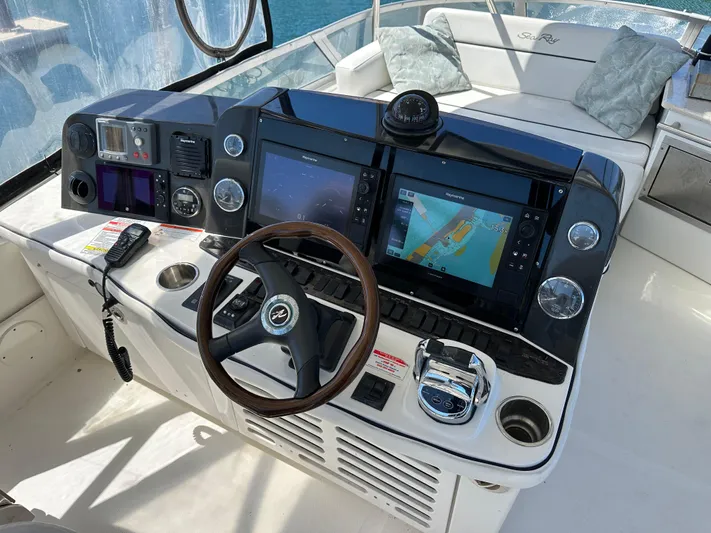  Yacht Photos Pics 2008 Sea Ray 47 Sedan Bridge helm with navigation screens and steering wheel.