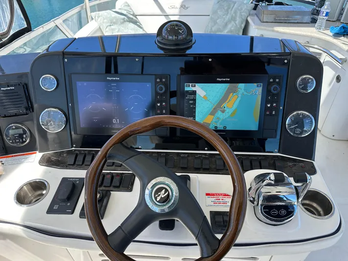  Yacht Photos Pics 2008 Sea Ray 47 Sedan Bridge helm with navigation screens and steering wheel.