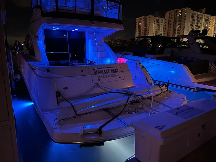  Yacht Photos Pics 2008 Sea Ray 47 Sedan Bridge yacht docked at night with blue LED lights.