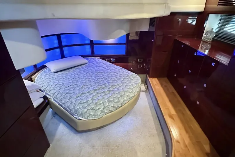  Yacht Photos Pics Luxurious bedroom interior of 2008 Sea Ray 47 Sedan Bridge yacht with ambient lighting.