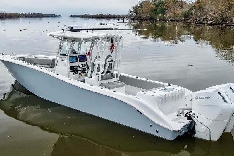  Yacht Photos Pics 2023 Cape Horn 34 XS boat on calm water, featuring dual Mercury engines.