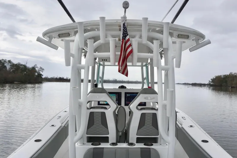  Yacht Photos Pics 2023 Cape Horn 34 XS boat with American flag on calm water.