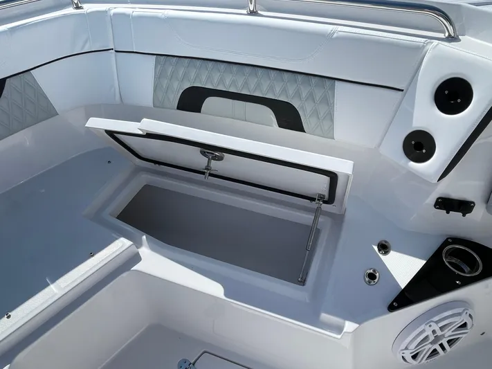 Med Blue Yacht Photos Pics 2025 Blackfin 272CC boat interior with open storage compartment and sleek design.