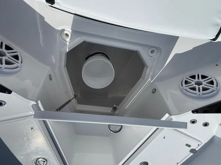 Med Blue Yacht Photos Pics 2025 Blackfin 272CC boat interior storage compartment with speakers and white finish.