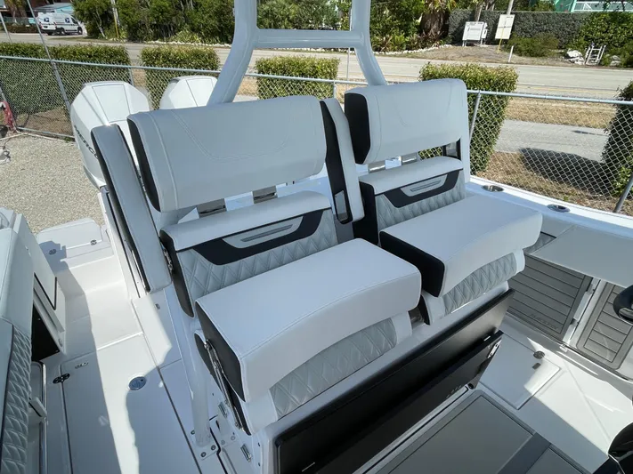 Med Blue Yacht Photos Pics 2025 Blackfin 272CC boat interior with luxurious white seating and modern design.