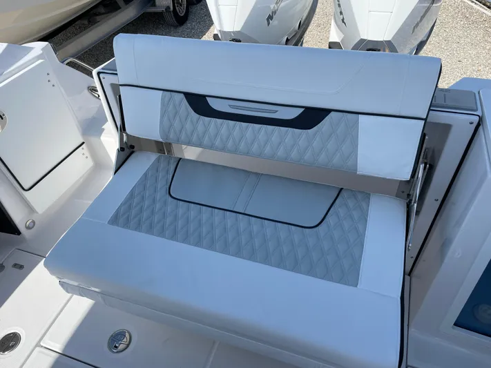 Med Blue Yacht Photos Pics 2025 Blackfin 272CC boat with white cushioned seating and modern design.