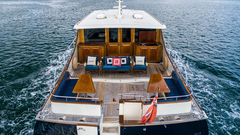 Essence Yacht Photos Pics Vicem 85 Classic 2006 yacht with elegant deck and seating, cruising on open water.