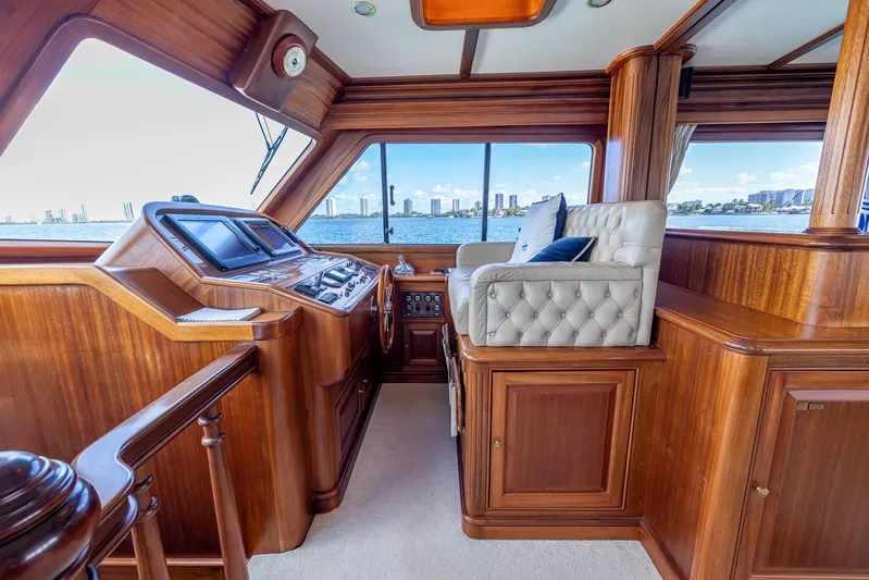Essence Yacht Photos Pics Luxurious 2006 Vicem 85 Classic yacht interior with wood paneling and plush seating.