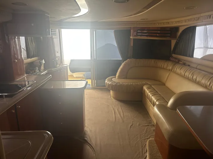 Another Chapter Yacht Photos Pics Luxurious interior of 1999 Sea Ray 480 Sedan Bridge yacht with plush seating and elegant design.