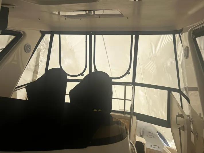 Another Chapter Yacht Photos Pics Interior view of 1999 Sea Ray 480 Sedan Bridge yacht with covered windows.