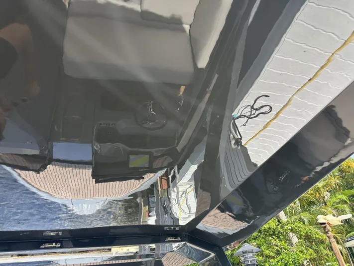 Rand Leisure 28 Yacht Photos Pics Interior view of a 2021 Rand Leisure boat with seating and control panel.