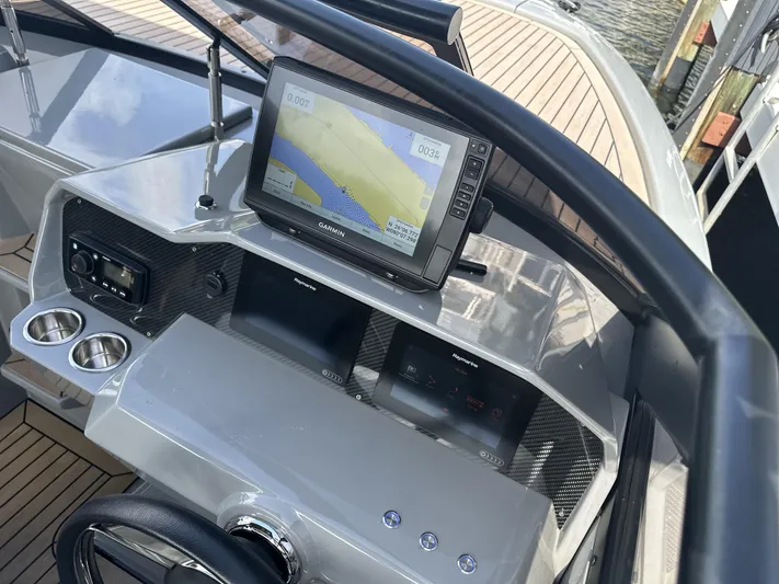 Rand Leisure 28 Yacht Photos Pics Dashboard of 2021 Rand Leisure boat with navigation system and cup holders.
