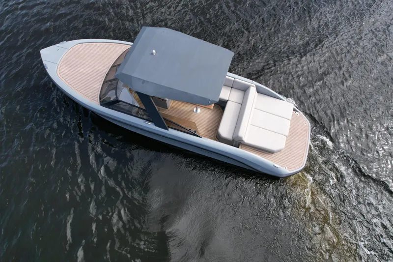 Rand Leisure 28 Yacht Photos Pics 2021 Rand Leisure boat cruising on calm water, featuring a sleek design and spacious seating.