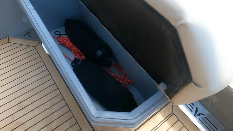 Rand Leisure 28 Yacht Photos Pics Storage compartment on a 2021 Rand Leisure boat with ropes and equipment.
