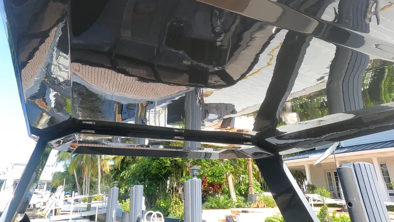Rand Leisure 28 Yacht Photos Pics 2021 Rand Leisure boat underside reflecting marina and palm trees.