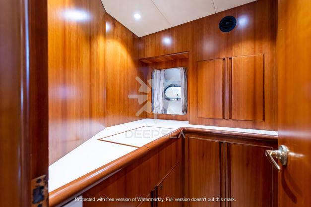 Luxurious wooden interior of a 2002 Vitech 58 yacht cabin.