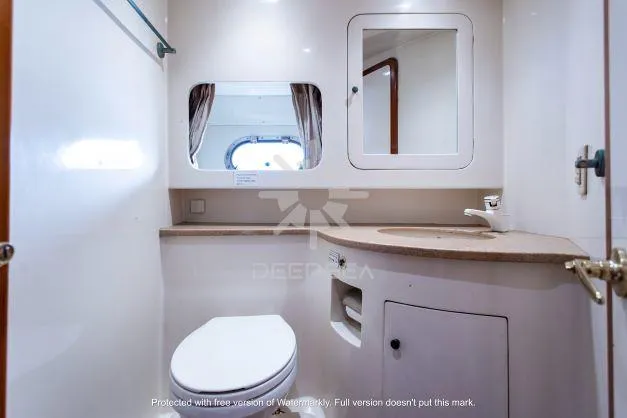 Luxurious bathroom in 2002 Vitech 58 yacht with modern fixtures and elegant design.