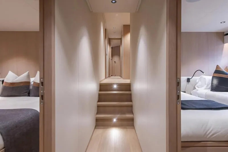 Crossover 27 #1 Yacht Photos Pics Luxurious interior of 2024 Lynx Crossover 27 yacht with elegant hallway and cozy bedrooms.