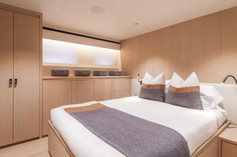 Crossover 27 #1 Yacht Photos Pics Luxurious bedroom interior of 2024 Lynx Crossover 27 yacht with modern design and cozy bedding.