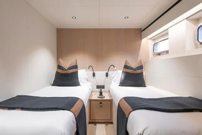 Crossover 27 #1 Yacht Photos Pics 2024 Lynx Crossover 27 cabin with twin beds, modern decor, and natural light.