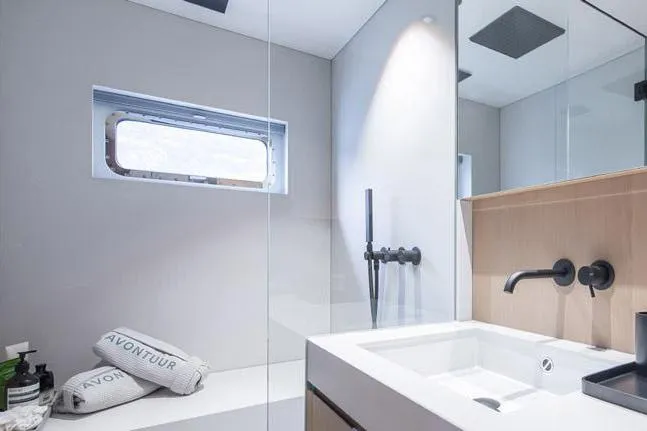 Crossover 27 #1 Yacht Photos Pics Modern bathroom in 2024 Lynx Crossover 27 yacht with sleek fixtures and natural light.