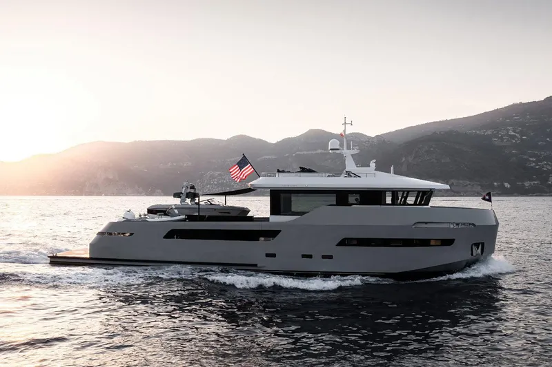 Crossover 27 #1 Yacht Photos Pics 2024 Lynx Crossover 27 yacht cruising at sunset with mountains in the background.