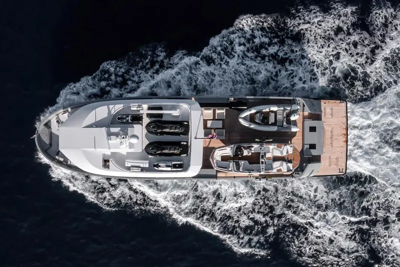 Crossover 27 #1 Yacht Photos Pics Aerial view of 2024 Lynx Crossover 27 yacht cruising on open water.