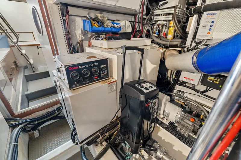 Yachtmaster Yacht Photos Pics Engine room of a 2002 Symbol 58 yacht with Onan Marine GenSet.