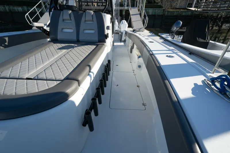 Full Send Yacht Photos Pics 2024 Freeman 38 boat interior with cushioned seating and rod holders.