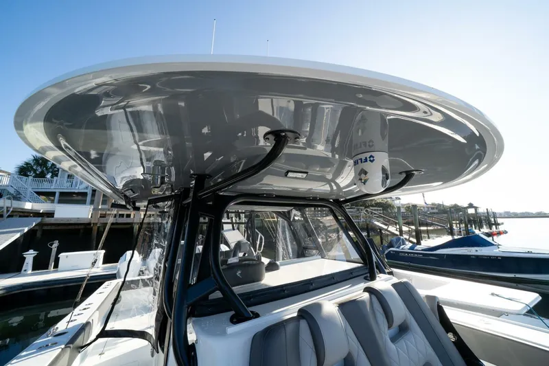 Full Send Yacht Photos Pics 2024 Freeman 38 boat with sleek design and modern seating at a marina.