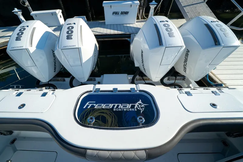 Full Send Yacht Photos Pics 2024 Freeman 38 boat with four powerful Mercury outboard engines at the dock.