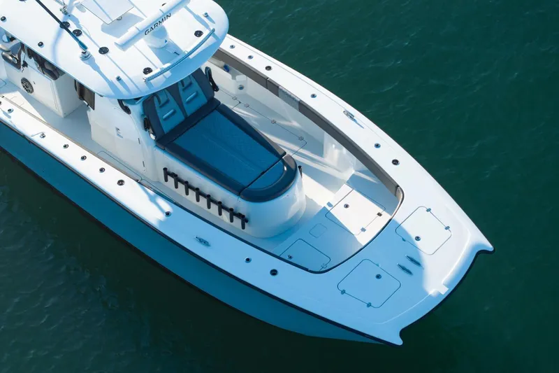 Full Send Yacht Photos Pics 2024 Freeman 38 boat on water, featuring sleek design and spacious deck layout.