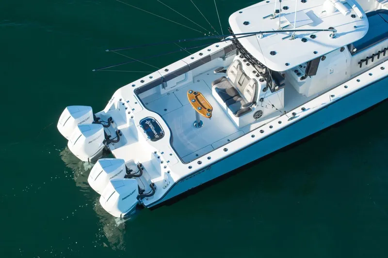 Full Send Yacht Photos Pics 2024 Freeman 38 boat with dual Mercury engines on calm water.